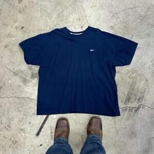 2000s silver nike tag on a navy blue logo tee